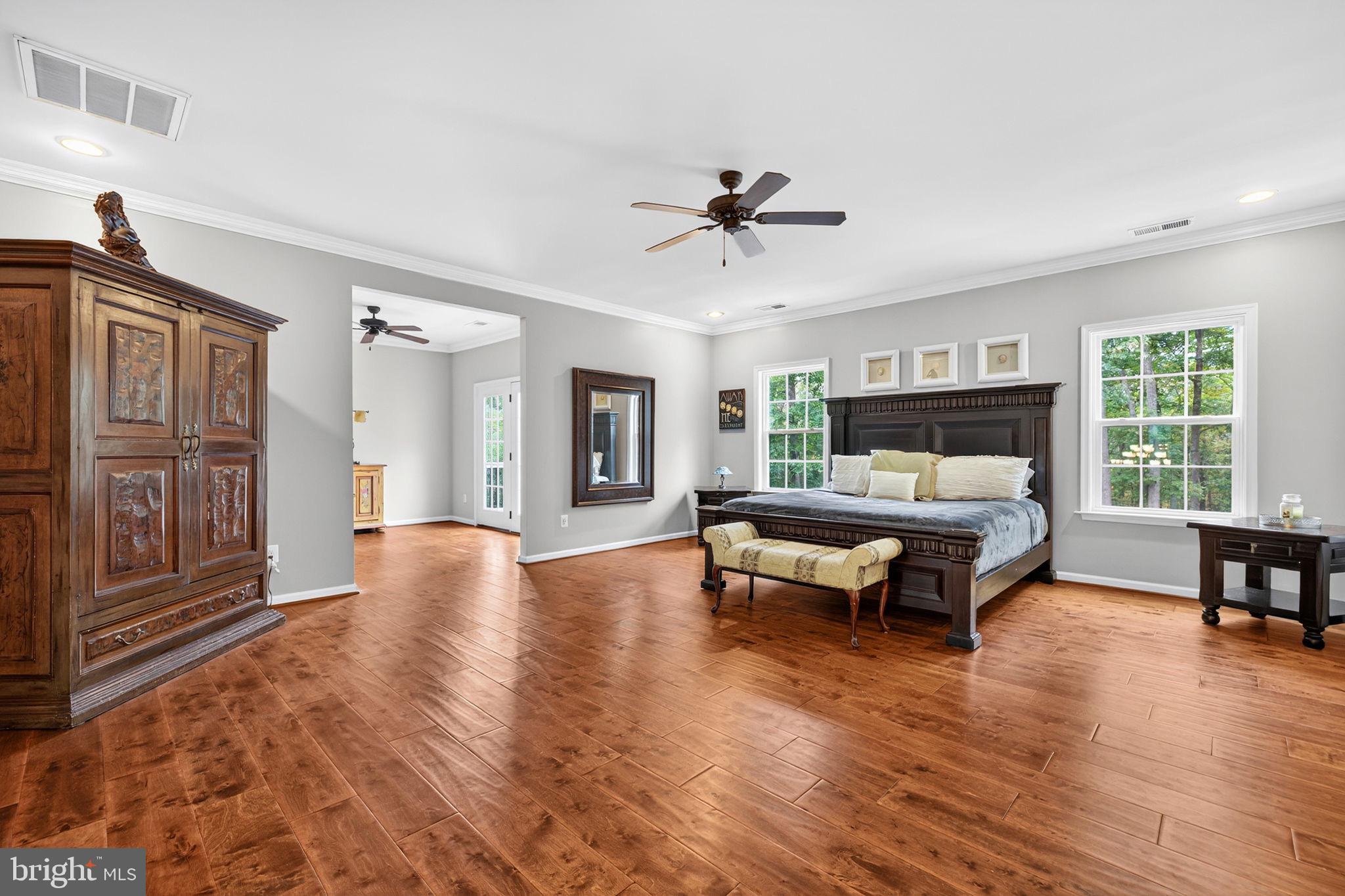 22011 Beaverdam Drive Ashburn, VA 20148 - Photo 73 of 106 Spacious bedroom with elegant wood accents.