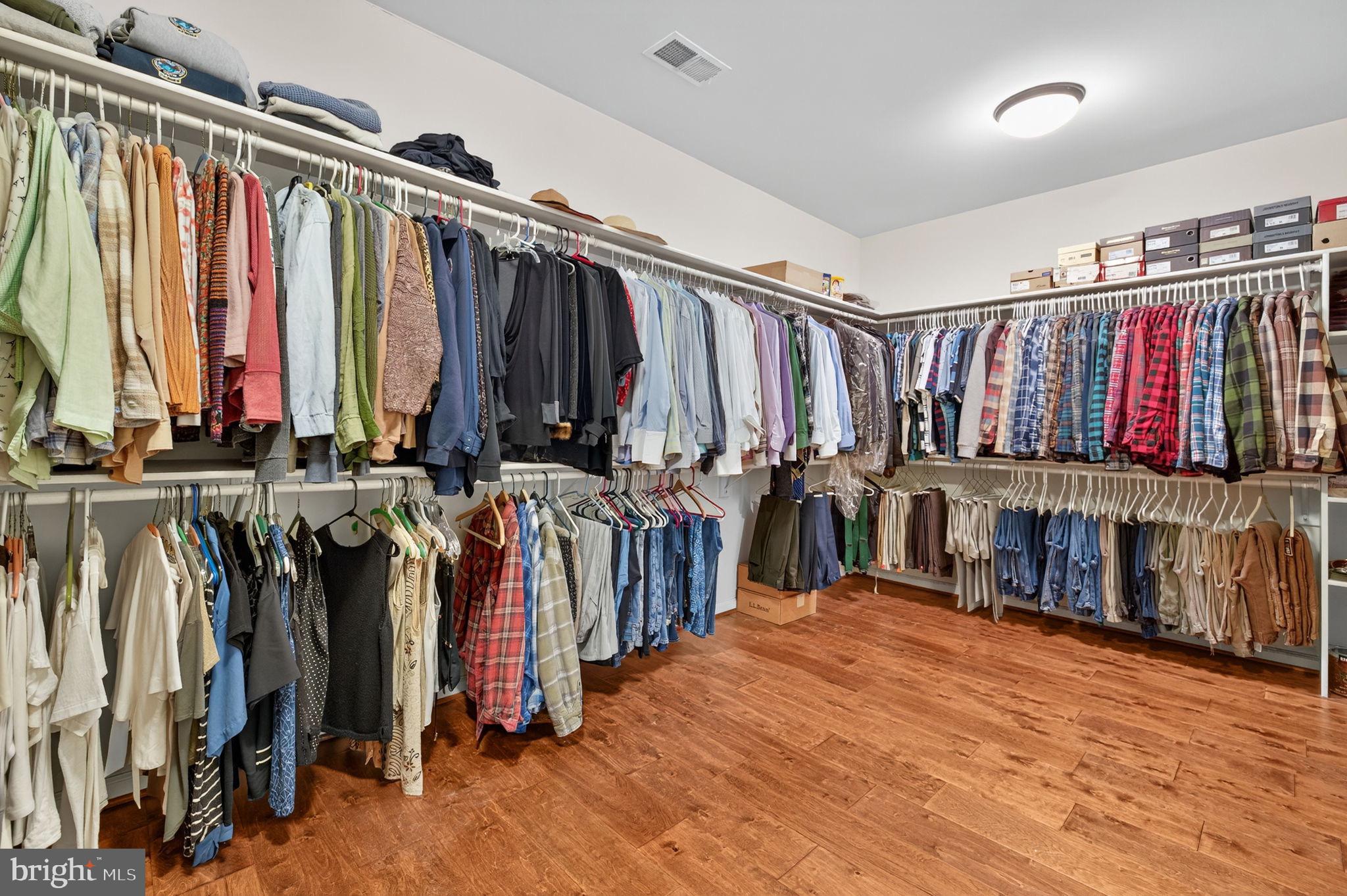 22011 Beaverdam Drive Ashburn, VA 20148 - Photo 74 of 109 Spacious closet with organized attire.