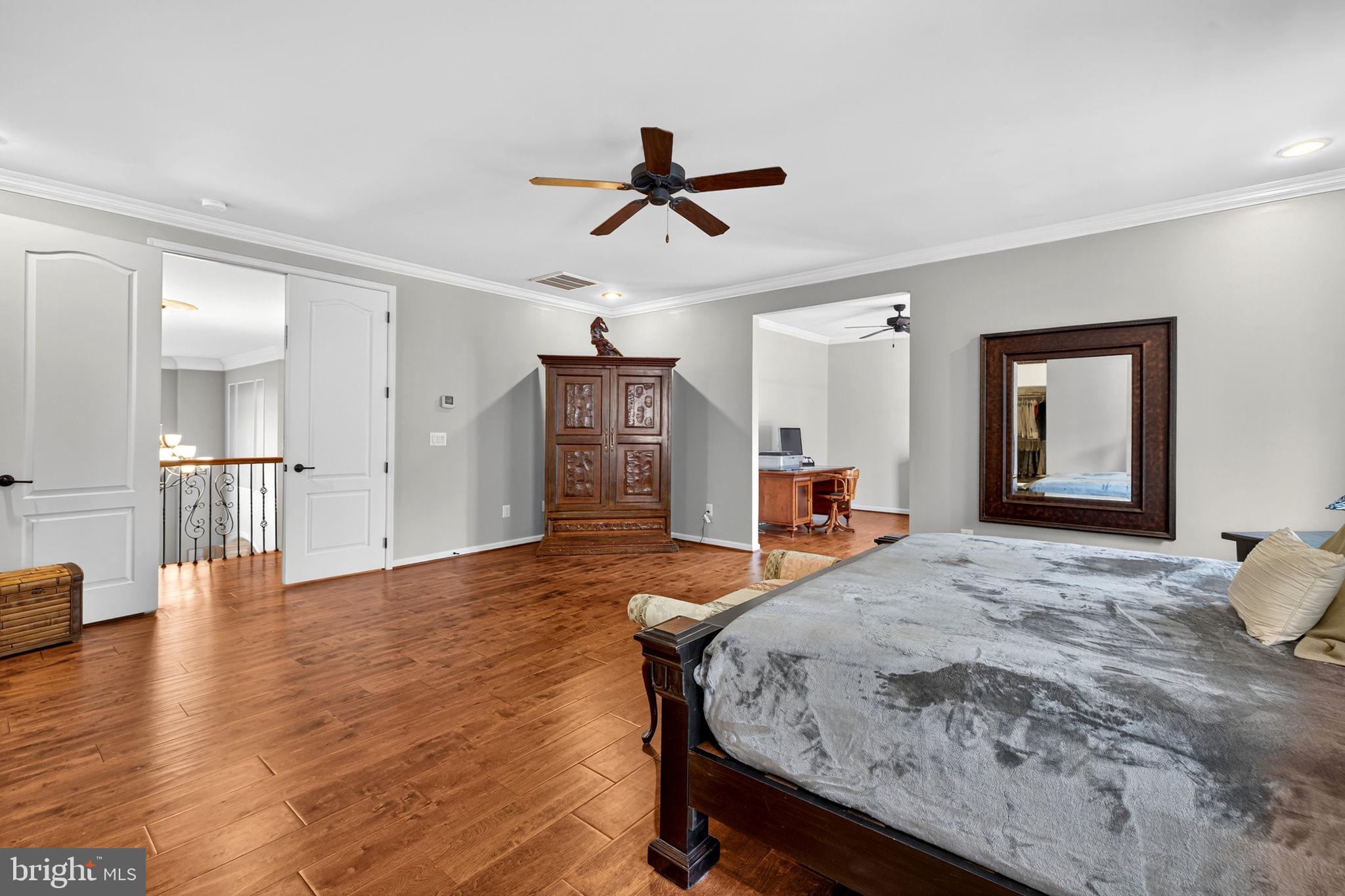 22011 Beaverdam Drive Ashburn, VA 20148 - Photo 76 of 106 a living room with furniture and a wooden floor