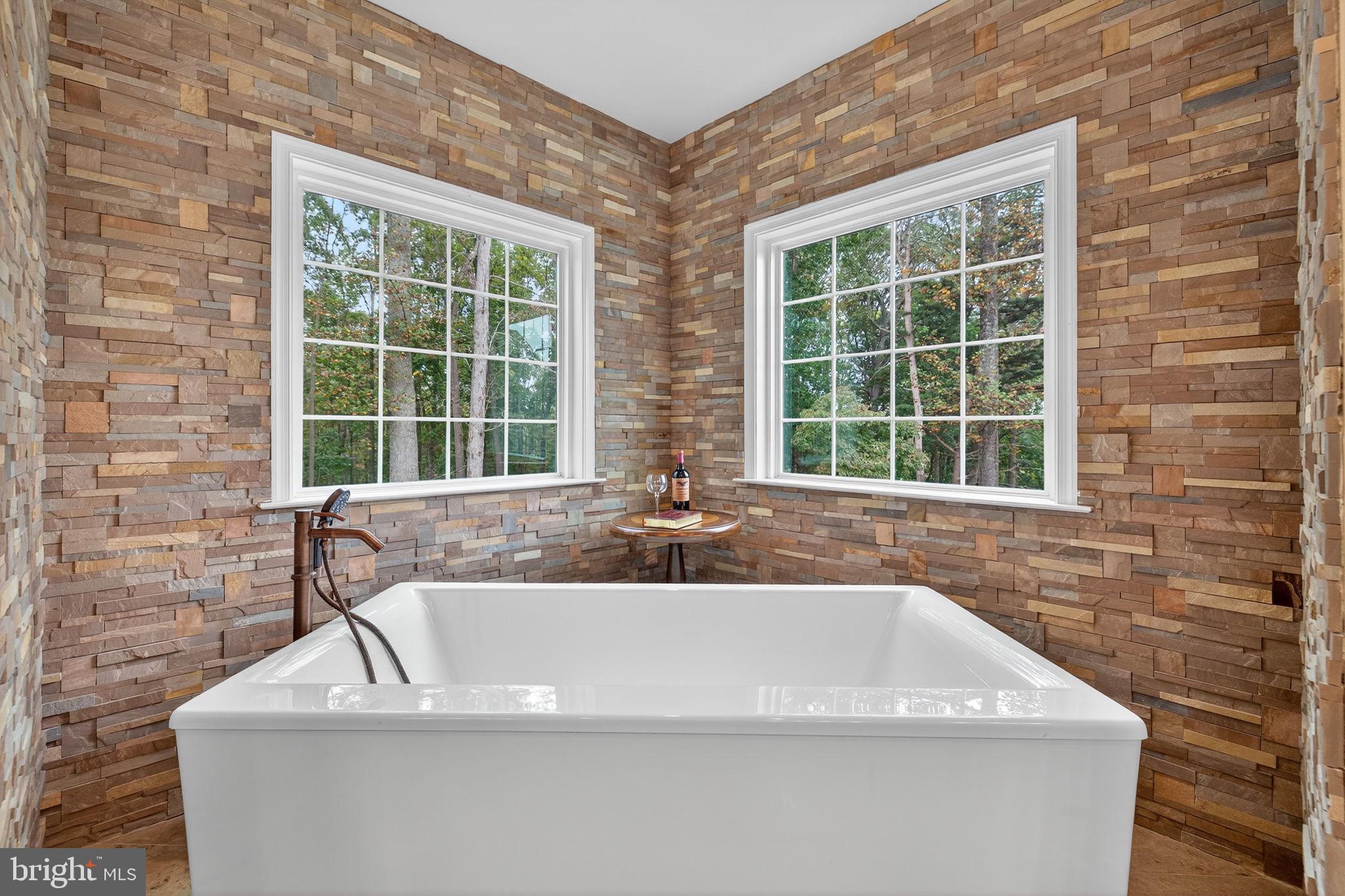 22011 Beaverdam Drive Ashburn, VA 20148 - Photo 77 of 109 Serene spa retreat with natural stone walls.