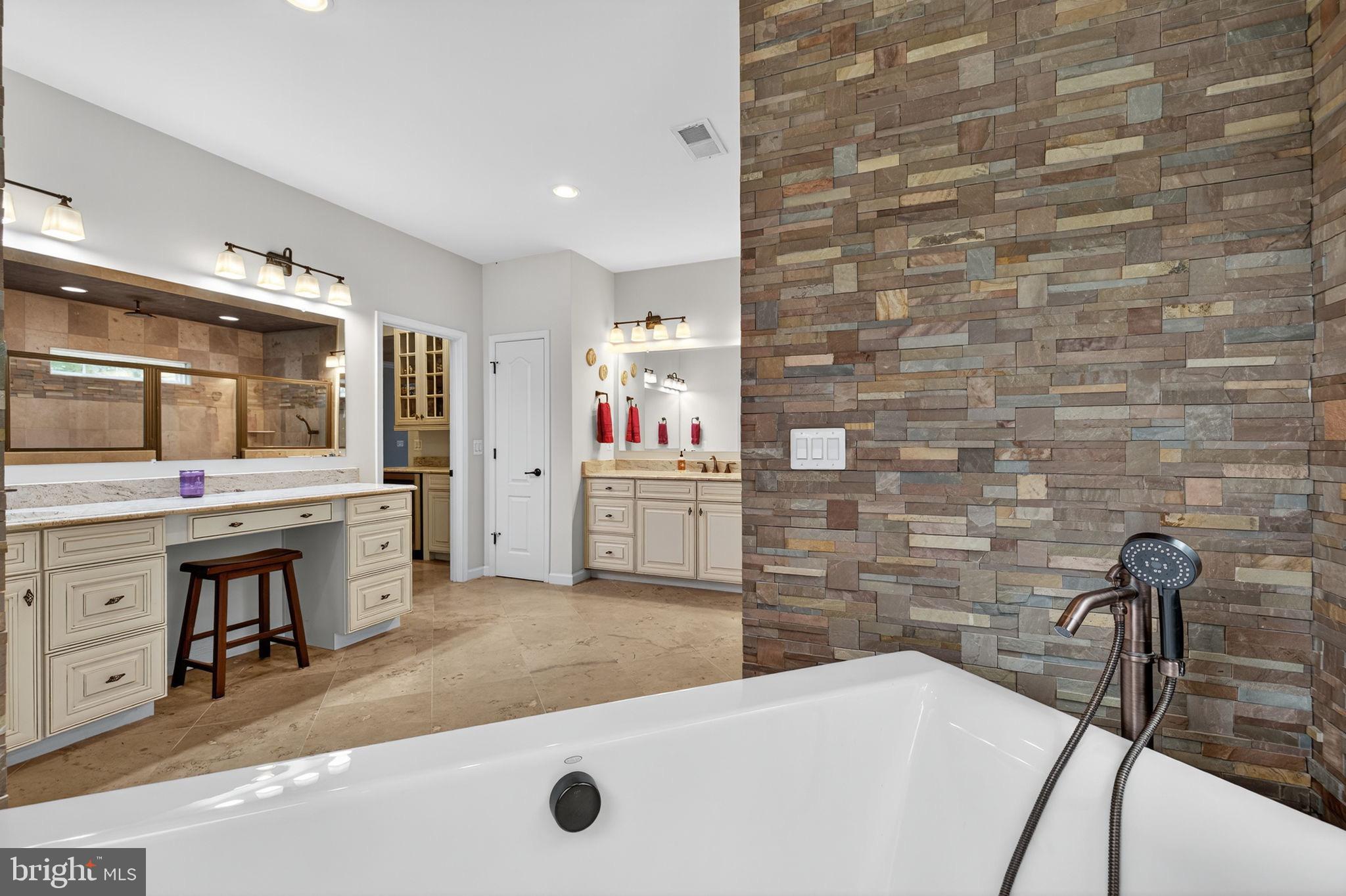 22011 Beaverdam Drive Ashburn, VA 20148 - Photo 78 of 109 Elegant bathroom with natural stone accents.