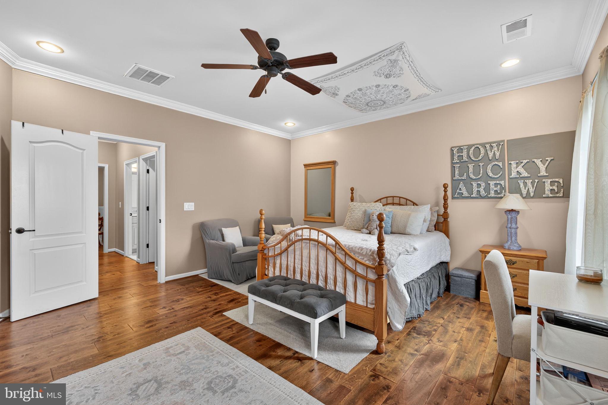 22011 Beaverdam Drive Ashburn, VA 20148 - Photo 86 of 109 Serene bedroom with warm wooden accents.