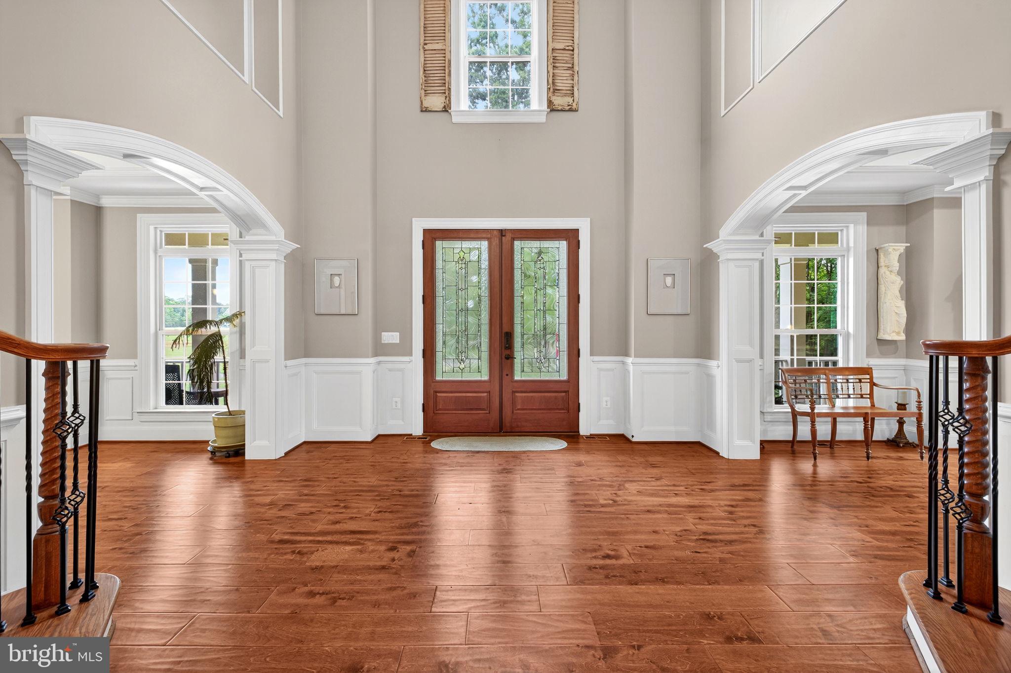 22011 Beaverdam Drive Ashburn, VA 20148 - Photo 9 of 109 Elegant foyer with rich wood accents.