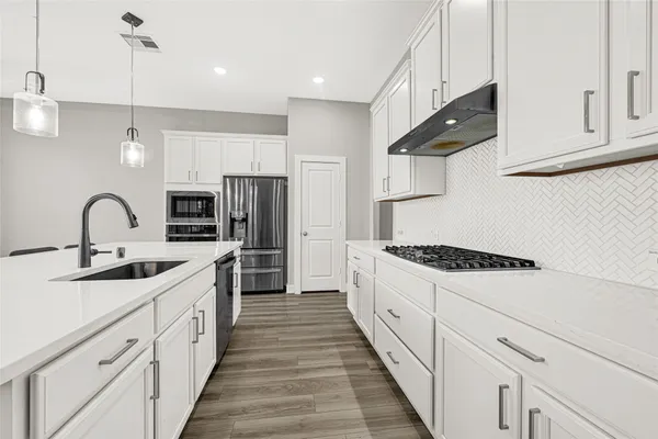 a spacious bedroom with a bed and a large window