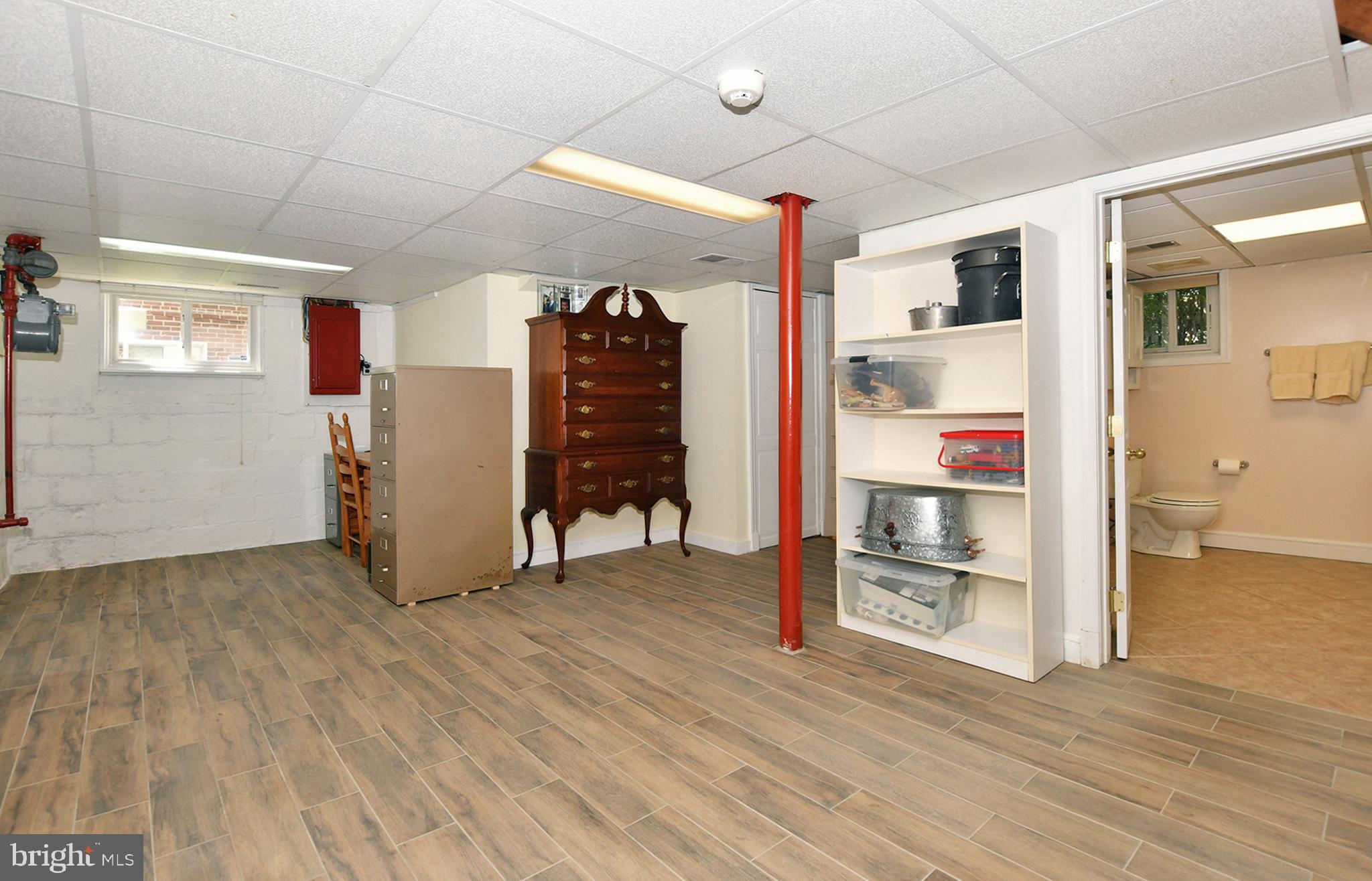 4515 Sleaford Road Bethesda, MD 20814 - Photo 35 of 47 Open Area in Lower Level with Windows & Tile Floor