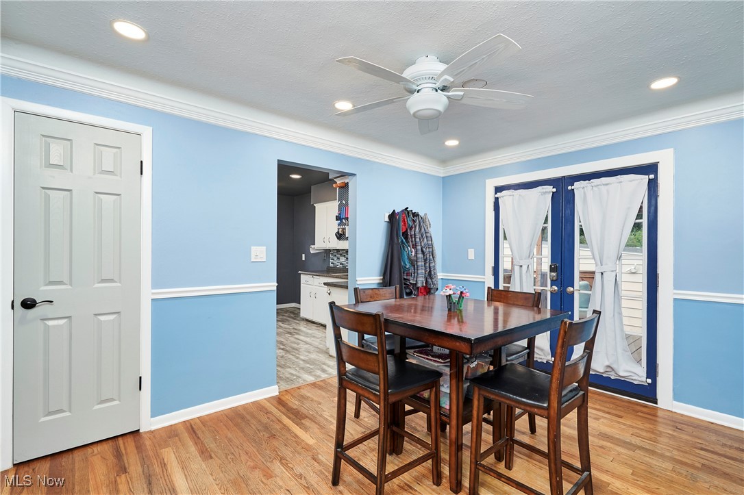 1129 Homestead Road Cleveland, OH 44121 - Photo 14 of 26 Dining space with french doors, hardwood floors, recessed lighting, a ceiling fan, and ornamental molding
