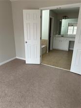 520 Hammersmith Drive Suwanee, GA 30024 - Photo 11 of 12 an empty room with a bathroom and mirror