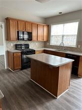 520 Hammersmith Drive Suwanee, GA 30024 - Photo 4 of 12 a kitchen with stainless steel appliances granite countertop a stove a sink and a microwave