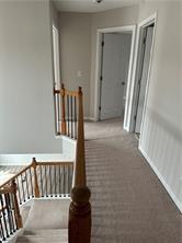520 Hammersmith Drive Suwanee, GA 30024 - Photo 8 of 12 a view of staircase with railing and a rug