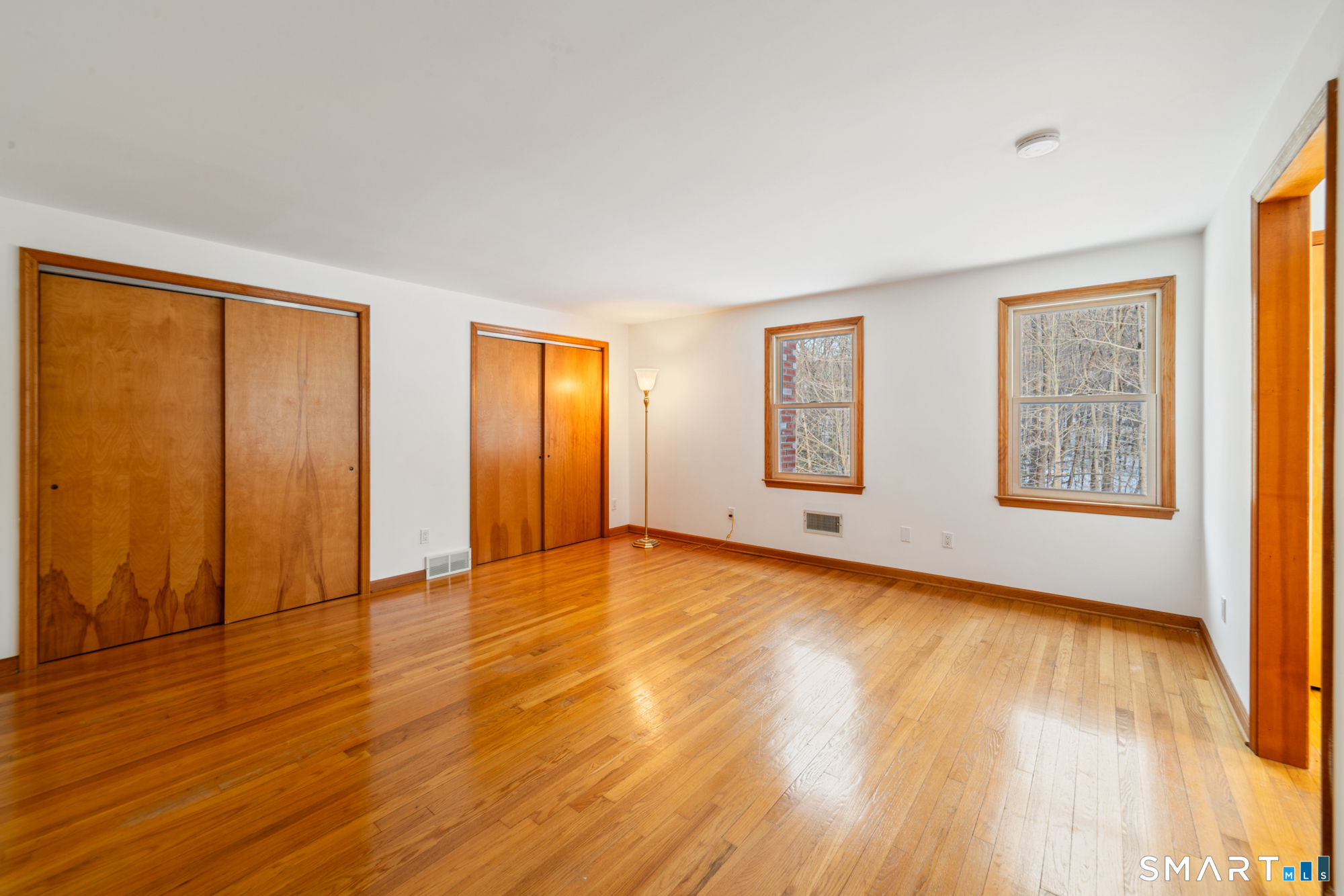672 Old Waterbury Road Southbury, CT 06488 - Photo 26 of 38 Primary bedroom with double closets, hardwood floor, dressing room and full bath
