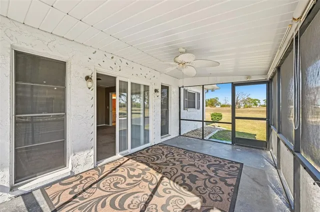 a view of a house with swimming pool and sitting area