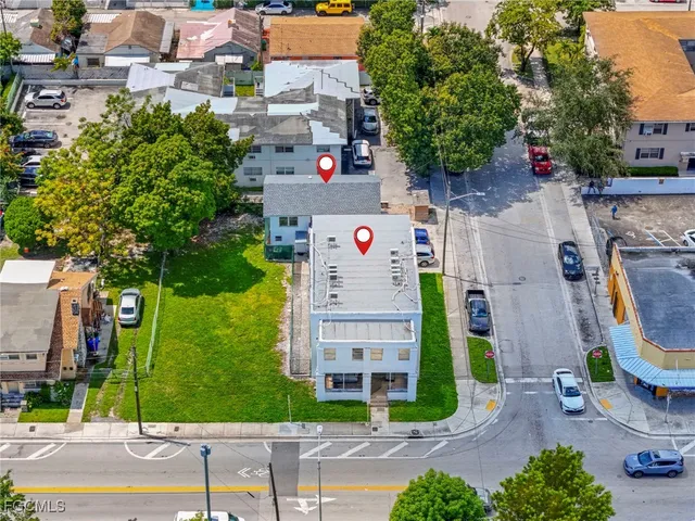 an aerial view of residential house with outdoor space and parking