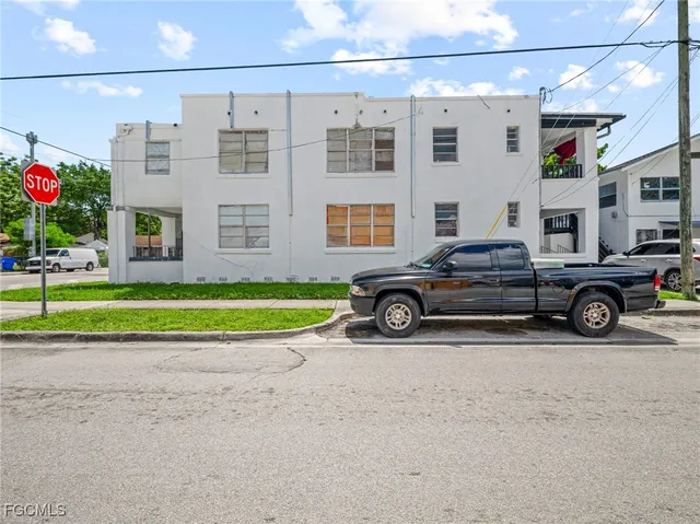 a view of a car parked in front of a building