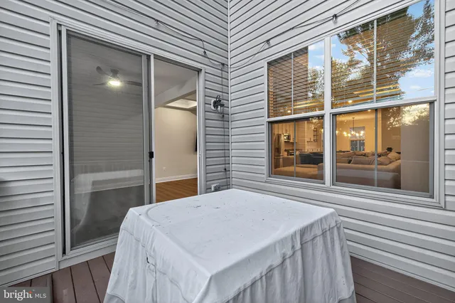 a large kitchen with granite countertop a lot of counter space and a wooden floor