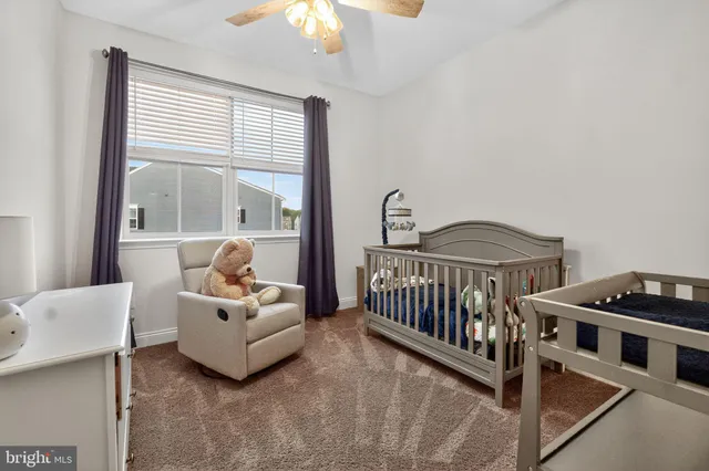 a bedroom with furniture and wooden floor