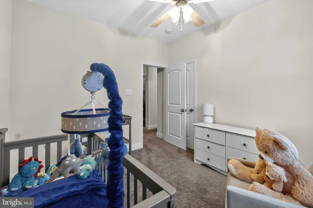 a bed room with a bed and a window