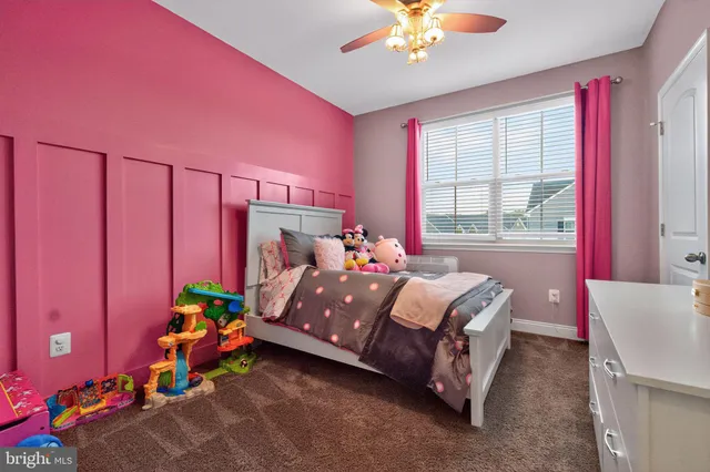 a view of a livingroom with furniture and a flat screen tv