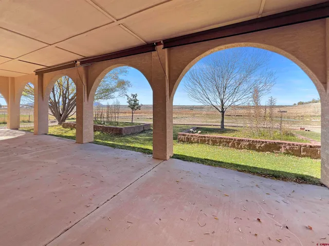 a view of empty room with wooden floor and outdoor space
