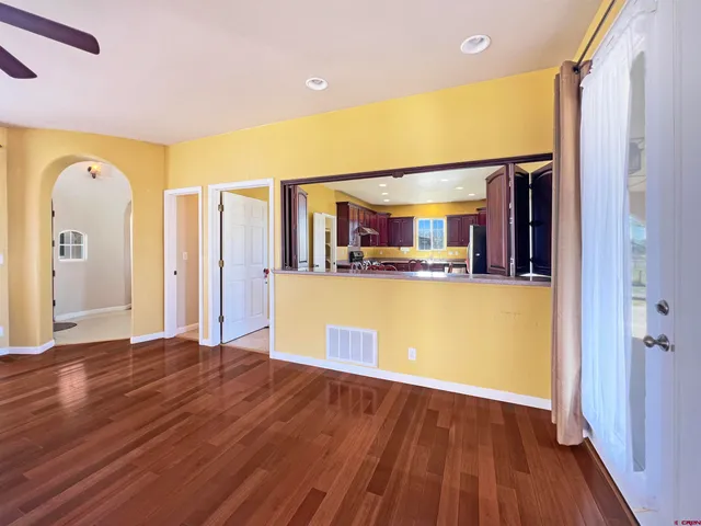a view of a kitchen with a sink and cabinet with wooden floor
