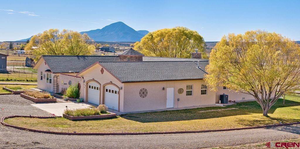 13723 Road 23 Cortez, CO 81321 - Photo 20 of 45 a view of a house with a yard