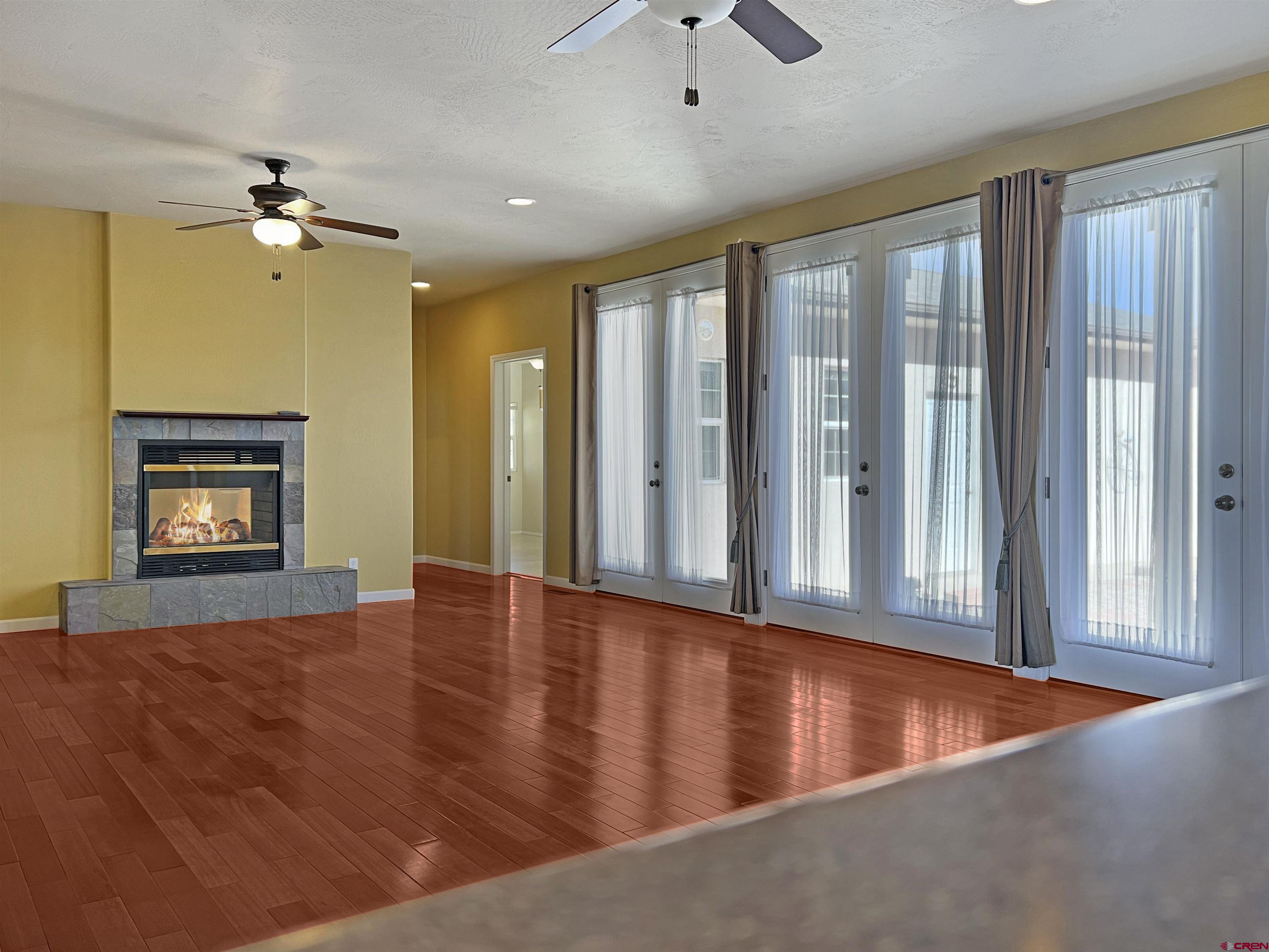 13723 Road 23 Cortez, CO 81321 - Photo 2 of 45 wooden floor in an empty room with a window