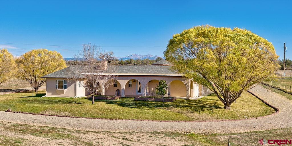 13723 Road 23 Cortez, CO 81321 - Photo 24 of 45 a view of a house with a yard