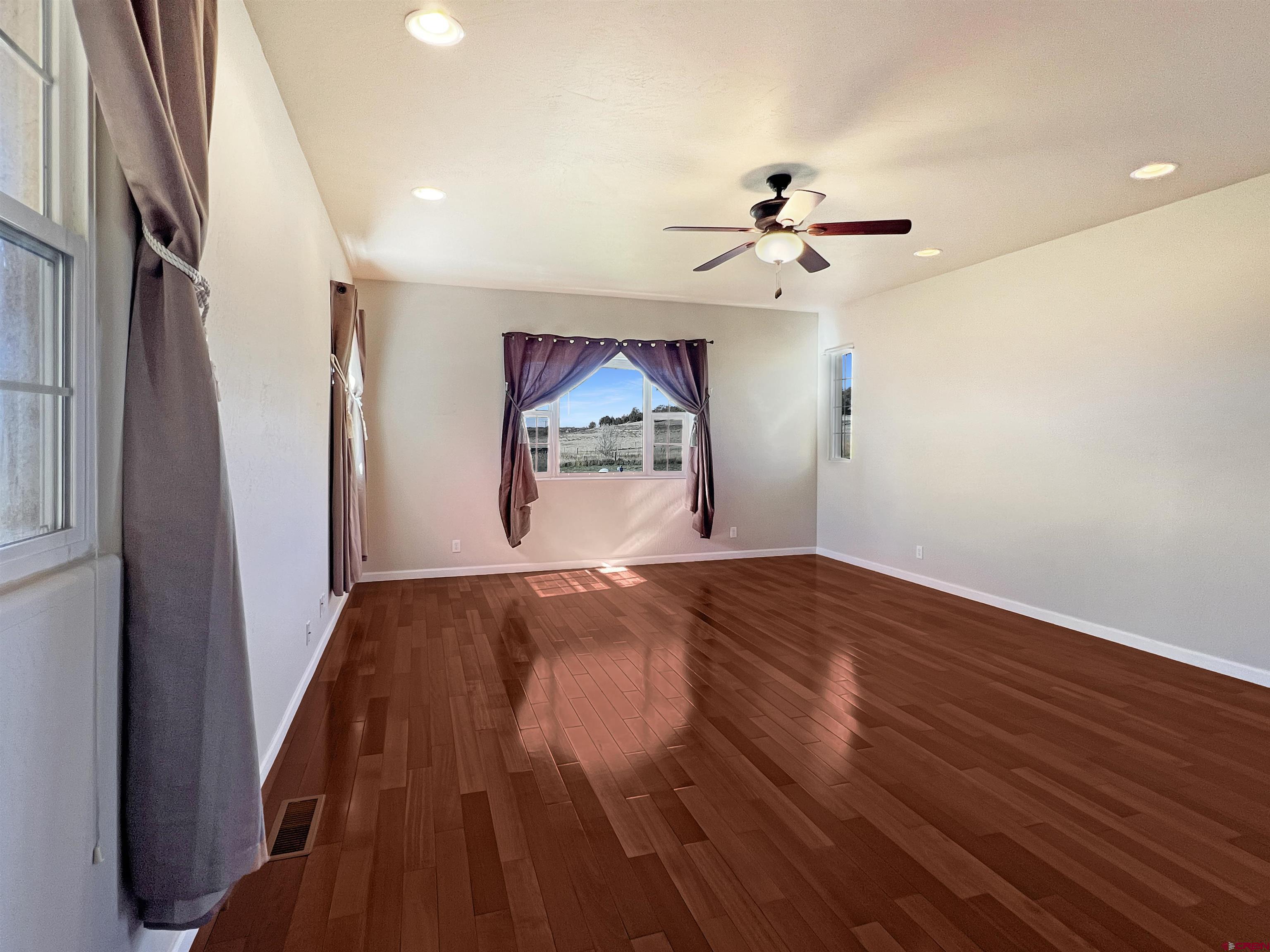 13723 Road 23 Cortez, CO 81321 - Photo 30 of 45 a view of empty room with wooden floor