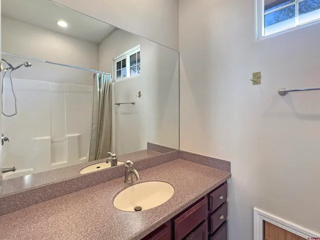 a bathroom with a sink a vanity and a mirror
