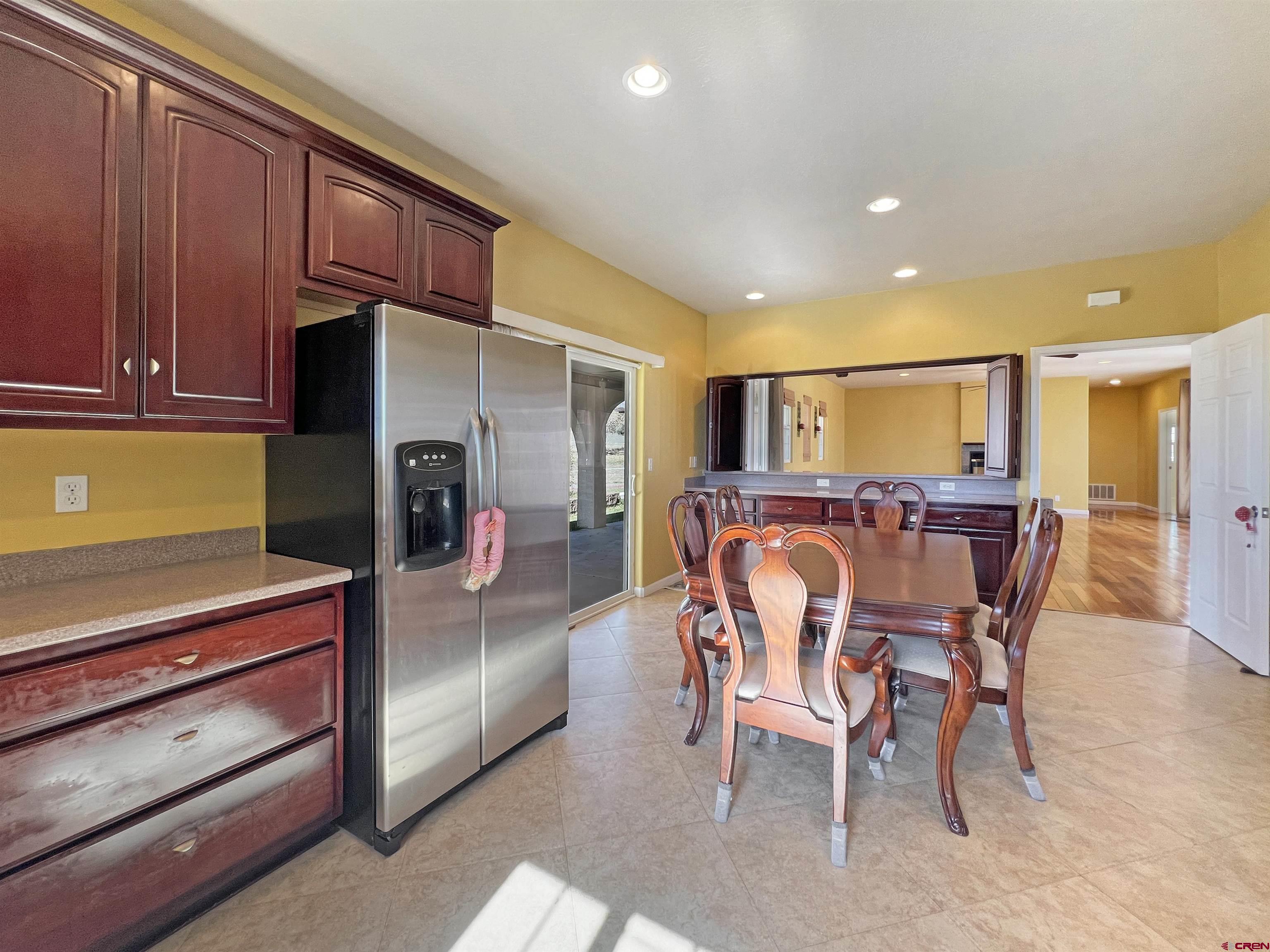 13723 Road 23 Cortez, CO 81321 - Photo 4 of 45 a dining room with furniture and a kitchen view