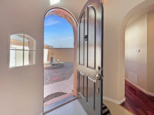 a view of front door with two mirror