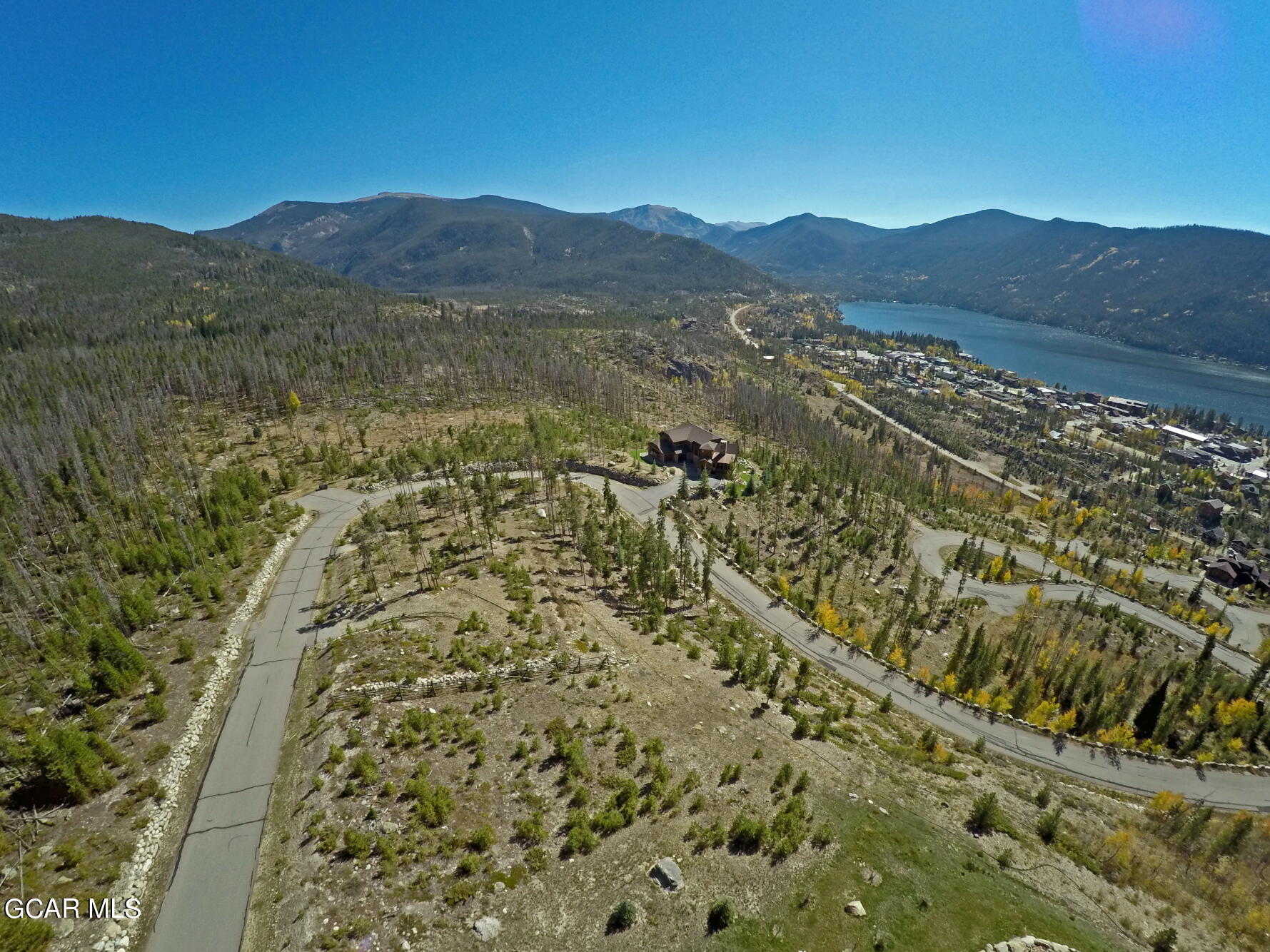 530 Old Tonahutu Ridge Road Grand Lake, CO 80447 - Photo 14 of 22 a view of a lush green hillside and a building