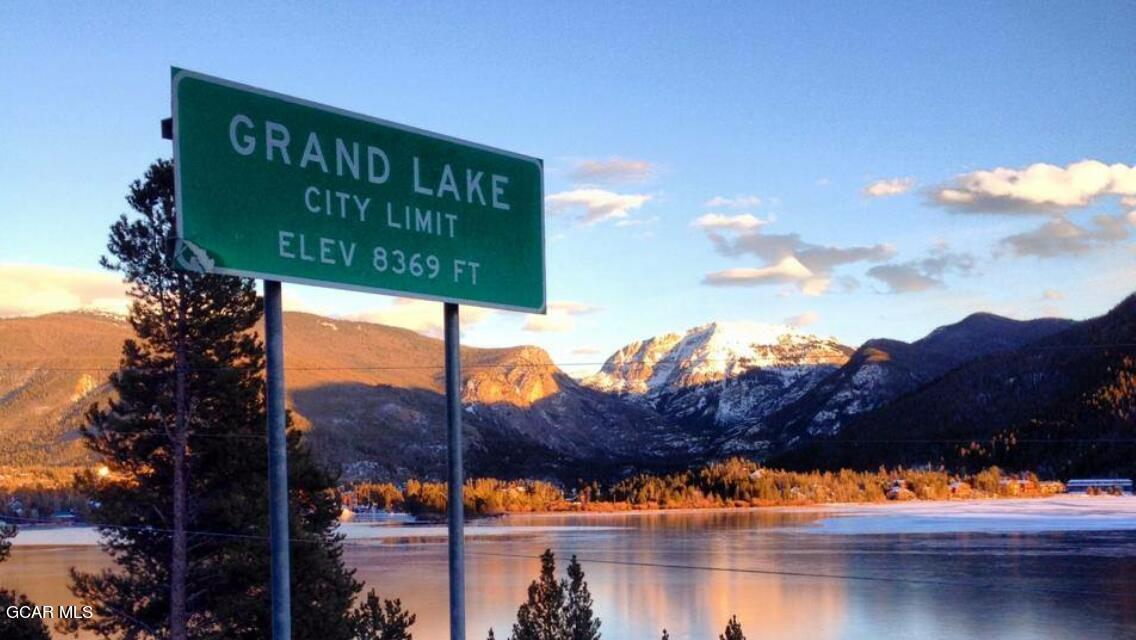 530 Old Tonahutu Ridge Road Grand Lake, CO 80447 - Photo 22 of 22 a sign that is sitting on a lake