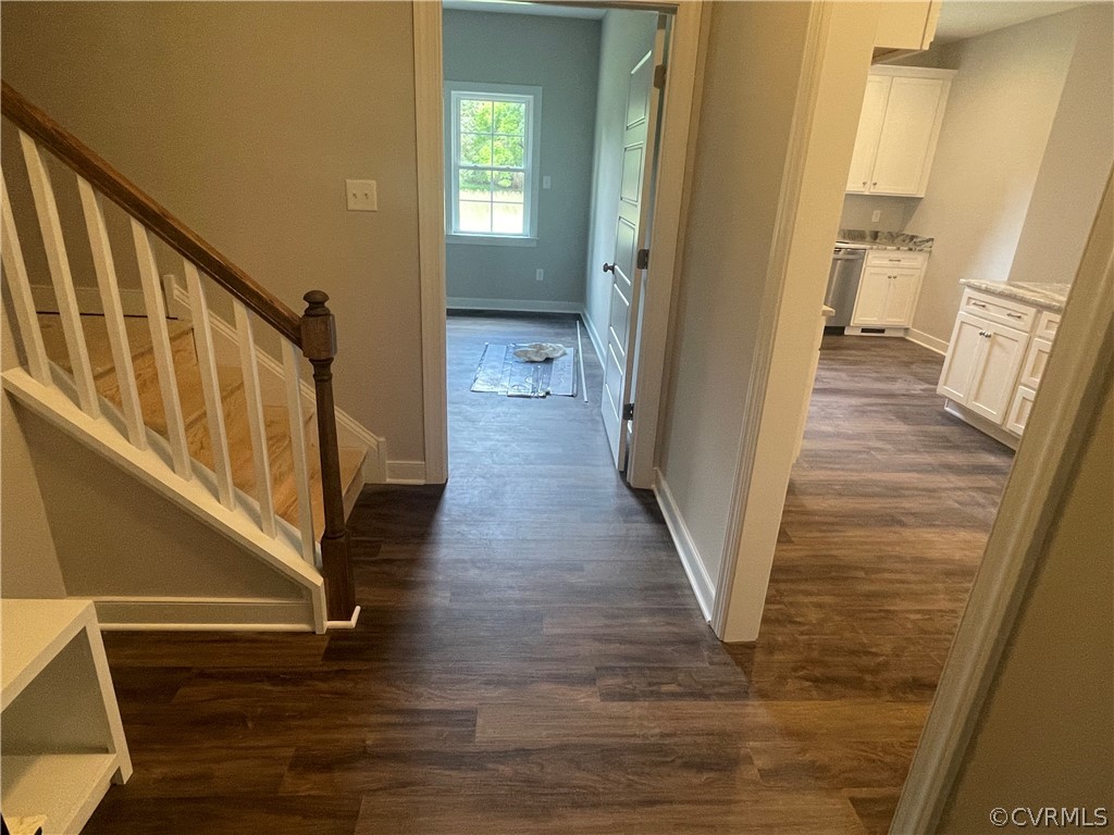 737 Rainbow Ridge Bumpass, VA 23024 - Photo 21 of 45 a view of a hallway with wooden floor and staircase