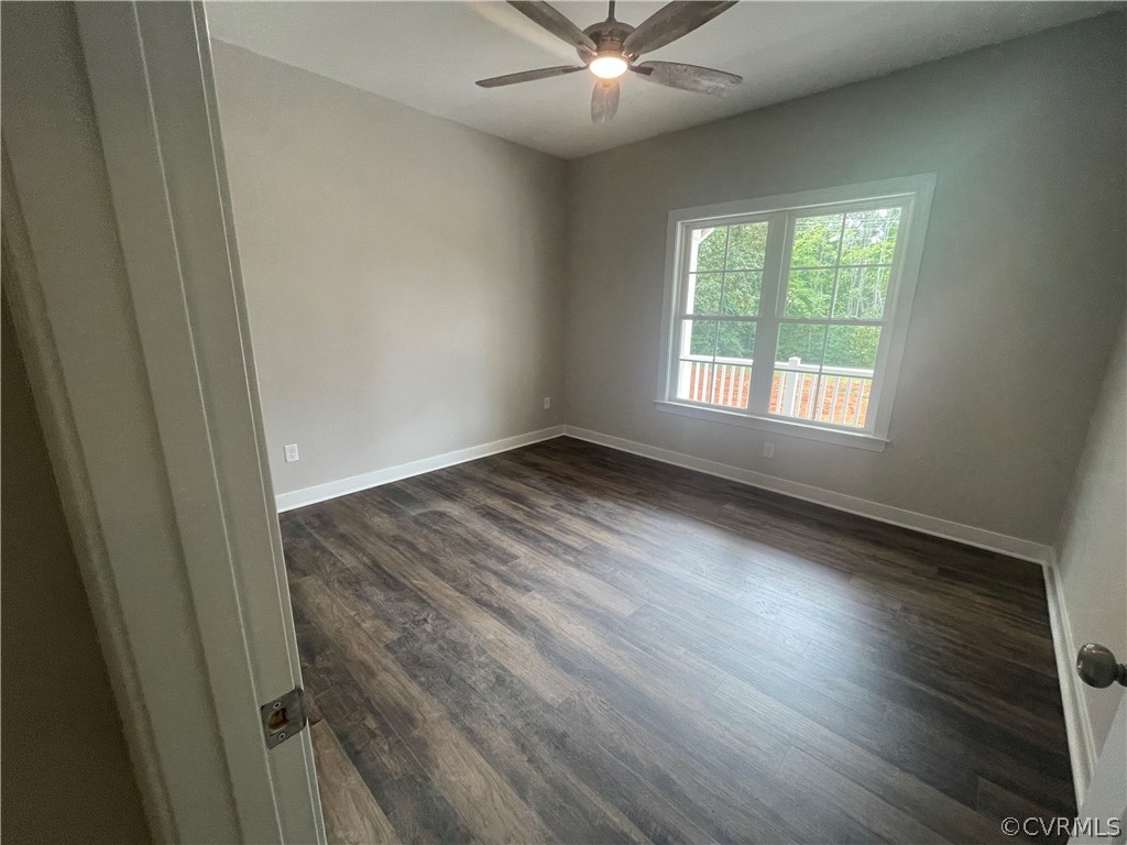 737 Rainbow Ridge Bumpass, VA 23024 - Photo 23 of 45 an empty room with wooden floor fan and windows