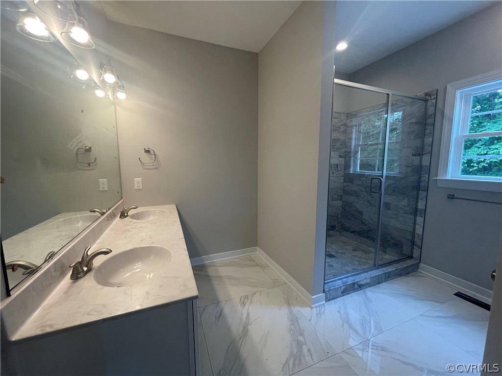 737 Rainbow Ridge Bumpass, VA 23024 - Photo 26 of 45 a bathroom with a sink and a mirror