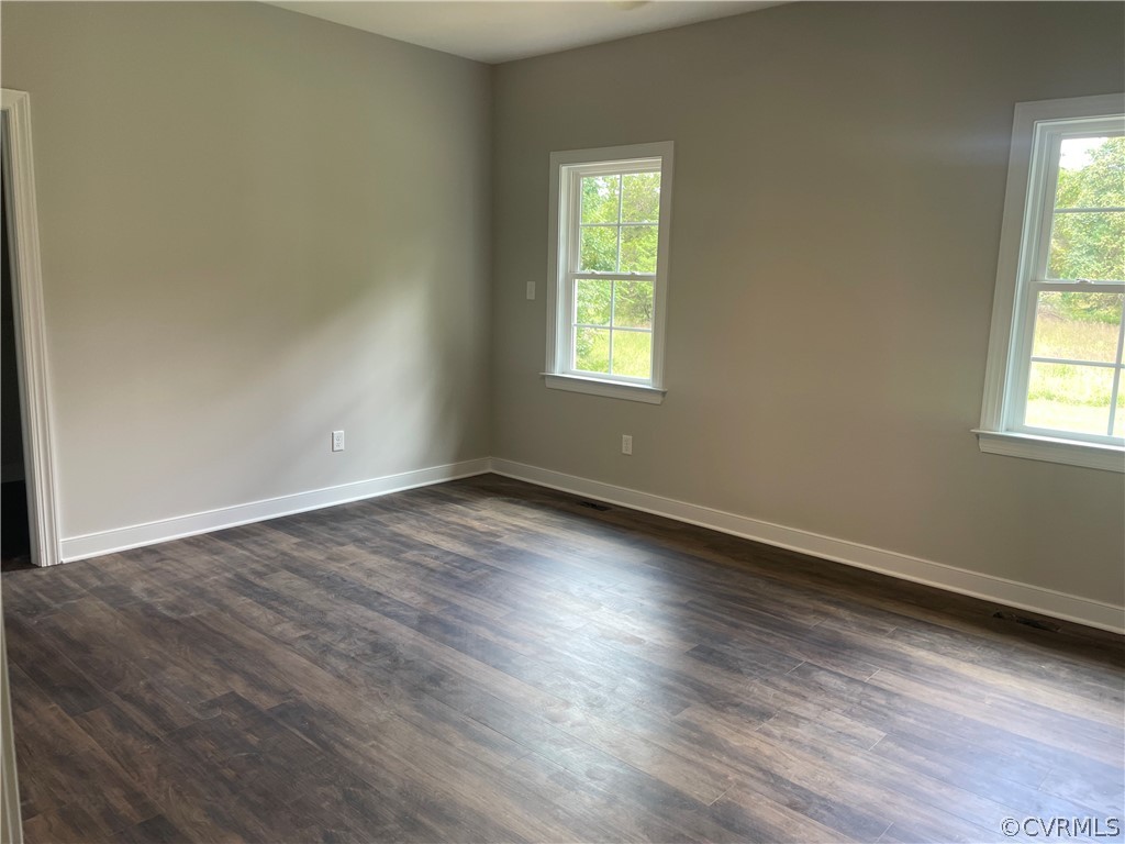 737 Rainbow Ridge Bumpass, VA 23024 - Photo 9 of 45 an empty room with wooden floor and windows