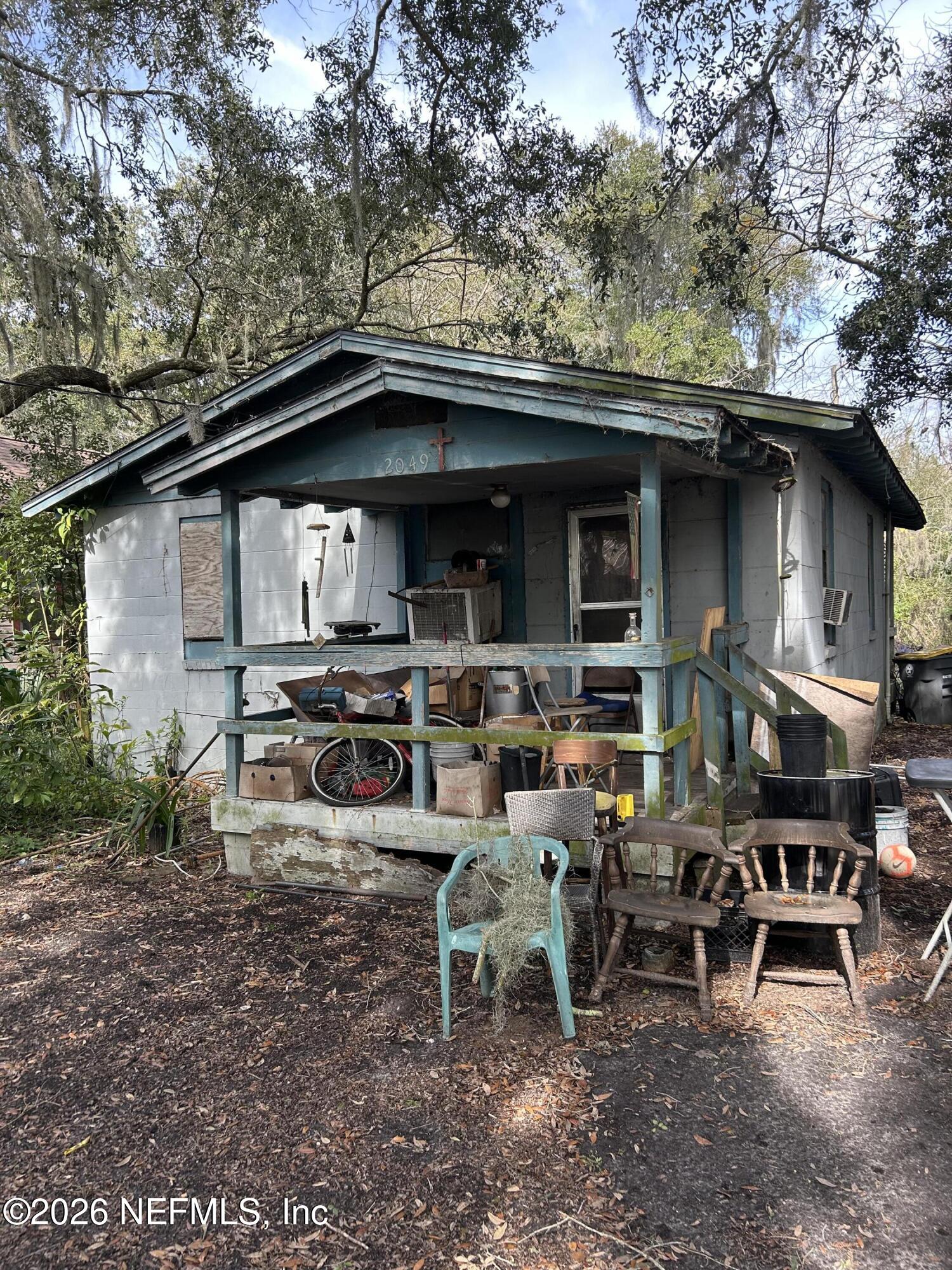 2049 Jernigan Road Jacksonville, FL 32207 - Photo 1 of 3 a backyard of a house with table and chairs