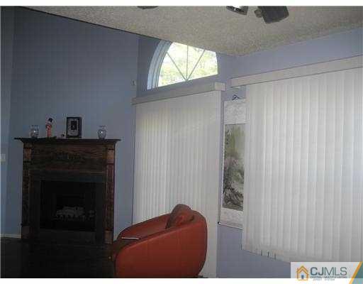 202 Nebula Road Piscataway, NJ 08854 - Photo 5 of 14 a living room with furniture and a fireplace