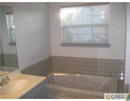 202 Nebula Road Piscataway, NJ 08854 - Photo 8 of 14 a bathroom with a bathtub