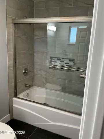 a bathroom with a shower and bathtub