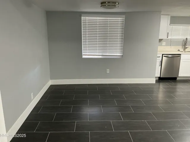 a bathroom with a bathtub and a window