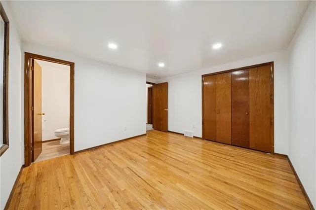 a bathroom with a sink mirror and toilet
