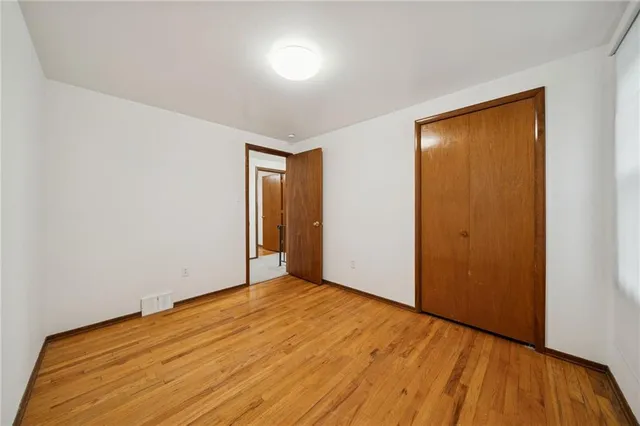 a view of a hallway with a room