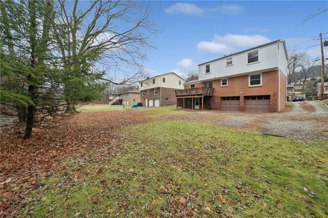 an aerial view of a house with a lake view