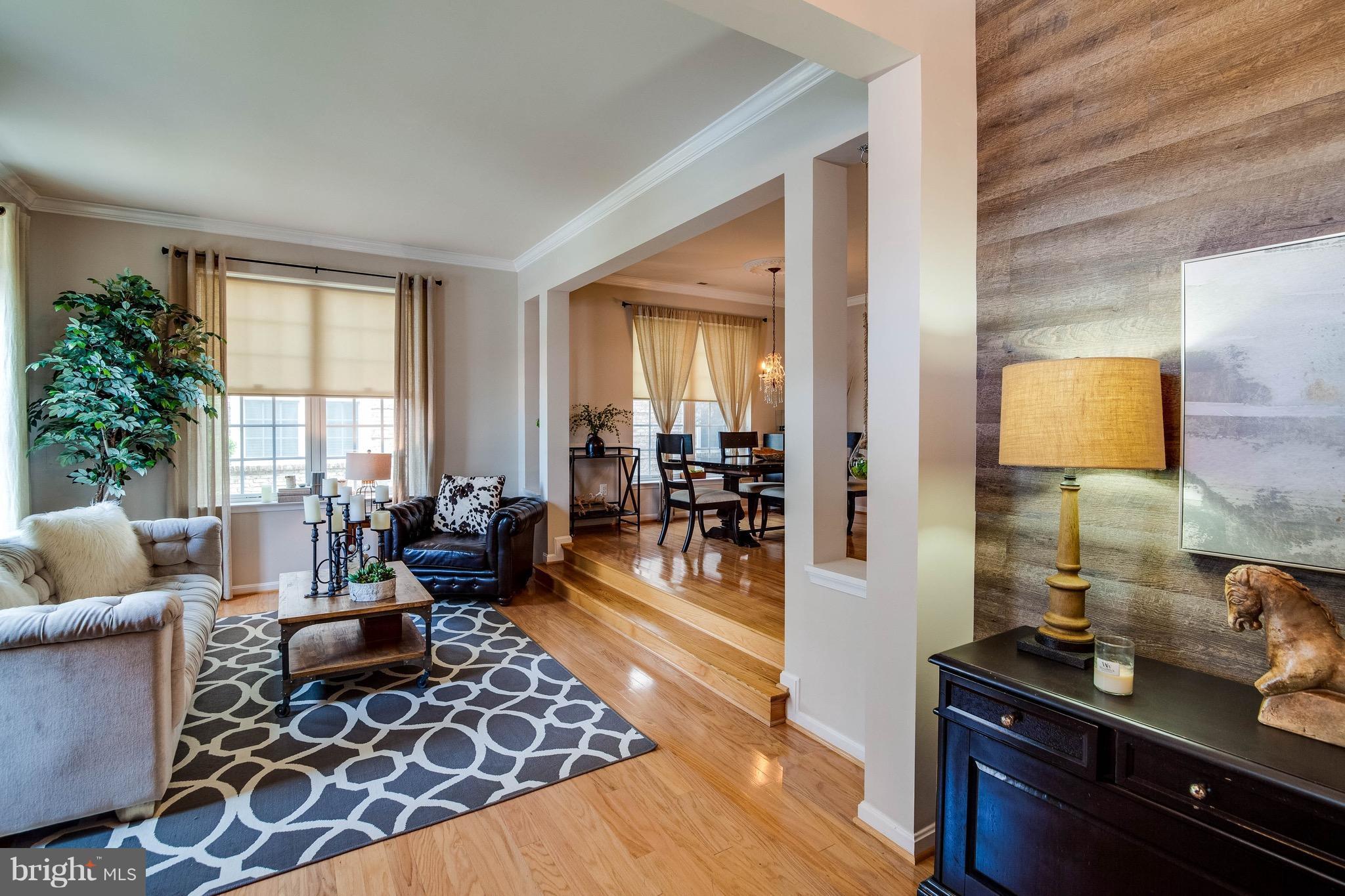 22960 Fanshaw Square Ashburn, VA 20148 - Photo 1 of 30 a living room with furniture and a lamp