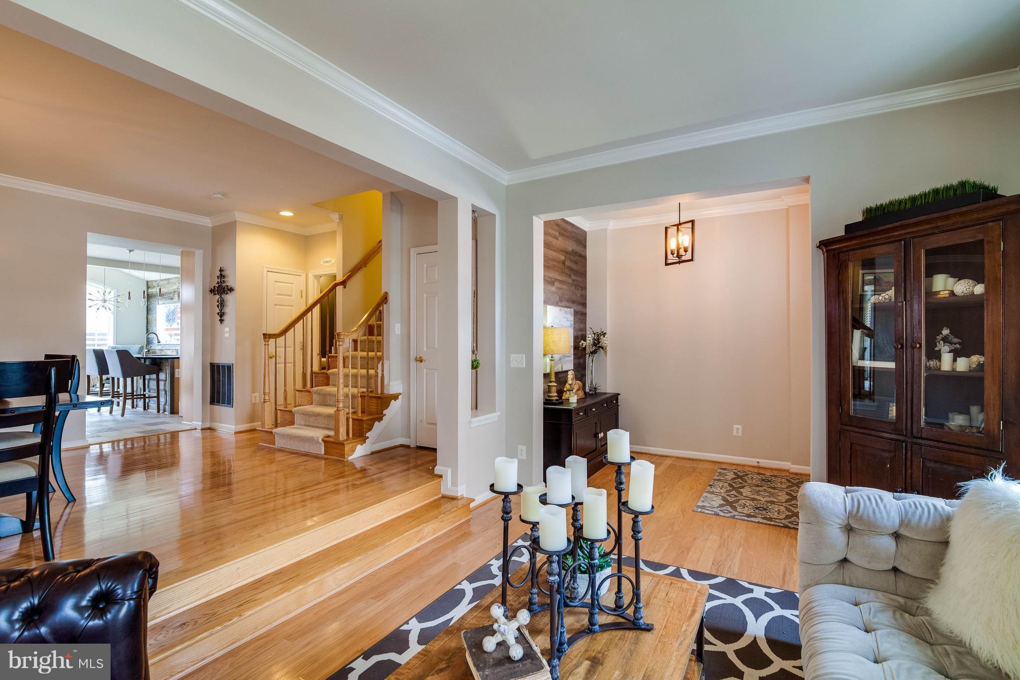 22960 Fanshaw Square Ashburn, VA 20148 - Photo 2 of 30 a living room with furniture and wooden floor
