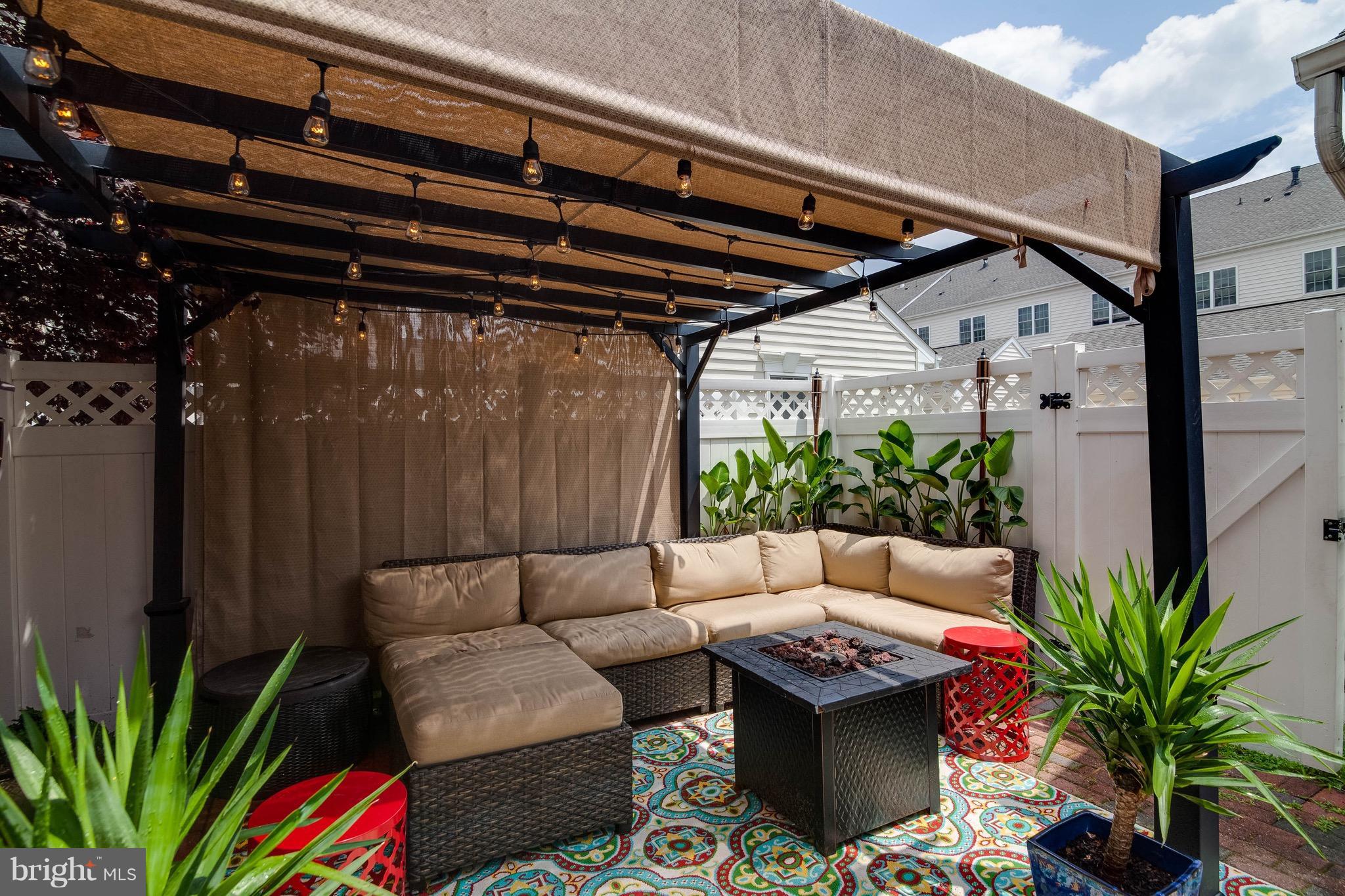 22960 Fanshaw Square Ashburn, VA 20148 - Photo 14 of 30 a view of patio with a table and chairs and potted plants