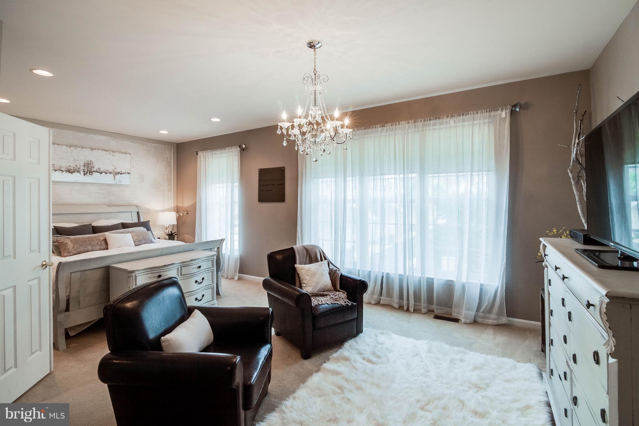 22960 Fanshaw Square Ashburn, VA 20148 - Photo 17 of 30 a living room with furniture and a flat screen tv