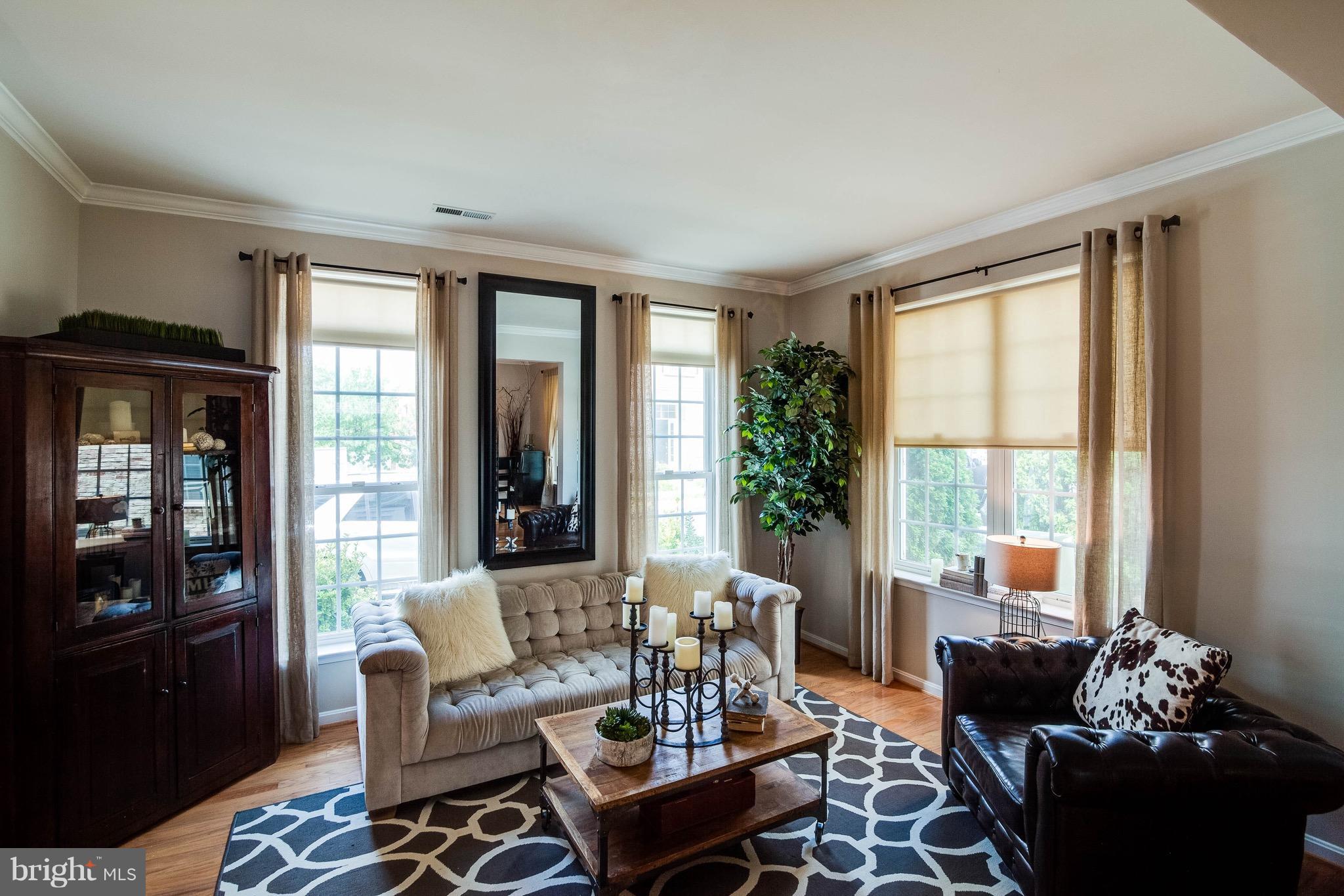 22960 Fanshaw Square Ashburn, VA 20148 - Photo 3 of 30 a living room with furniture and a large window