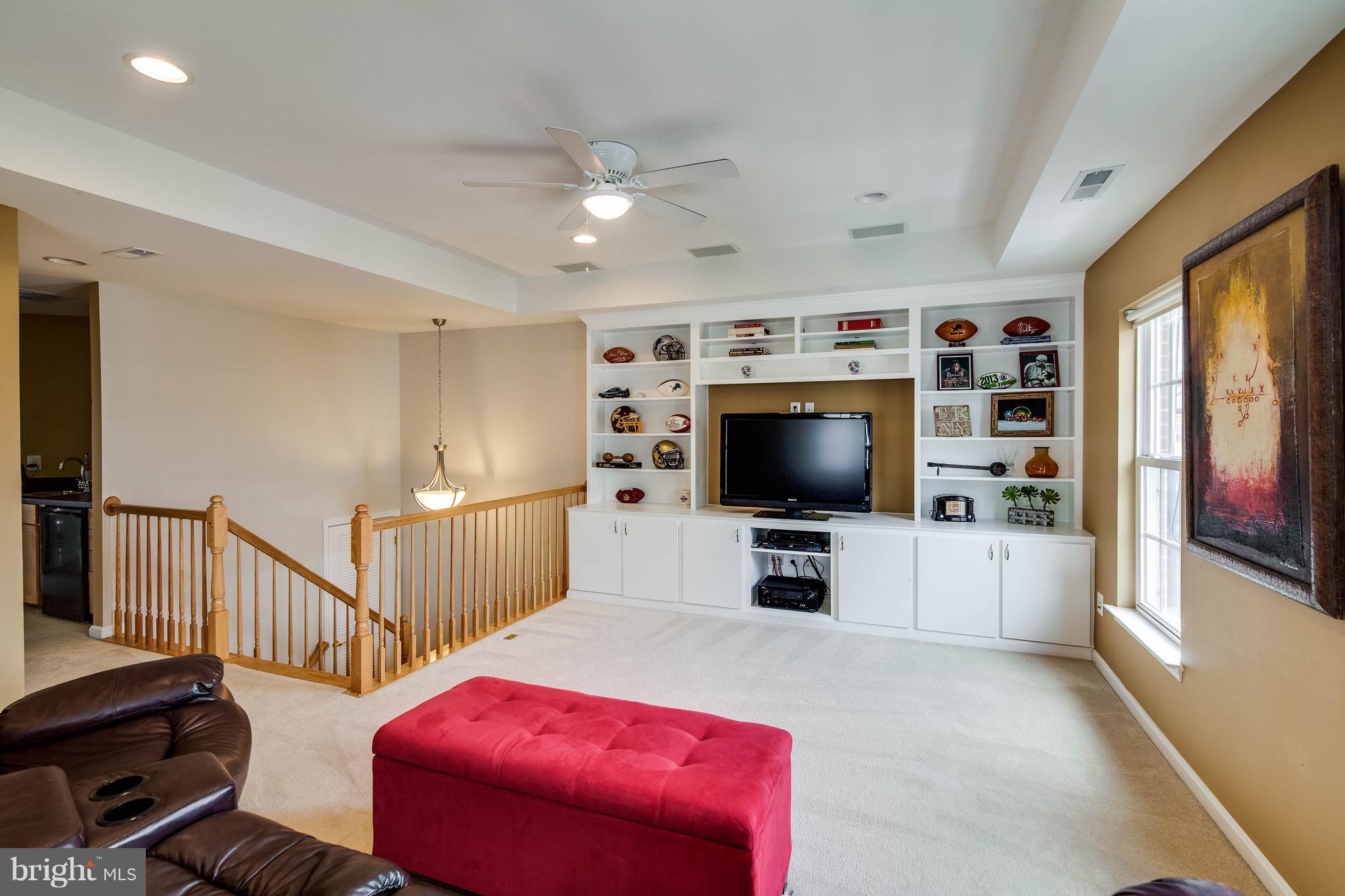22960 Fanshaw Square Ashburn, VA 20148 - Photo 28 of 30 a living room with furniture and a flat screen tv